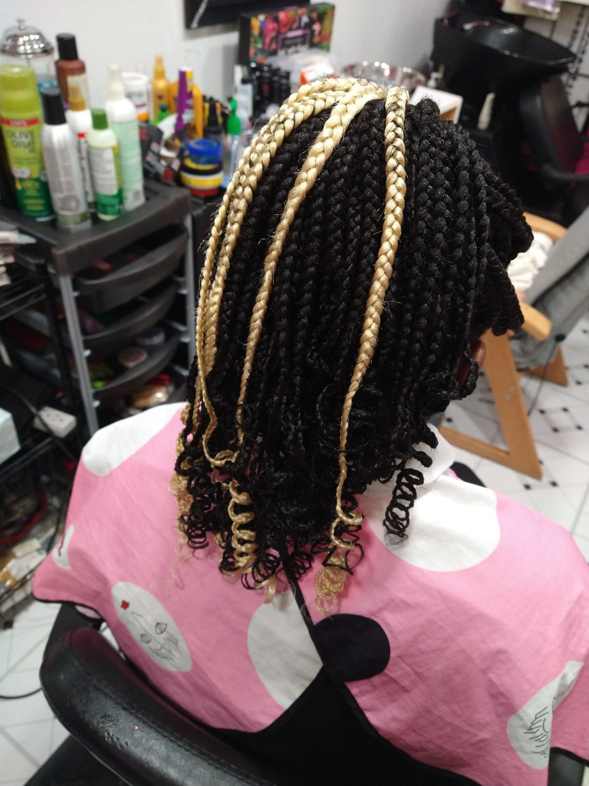 Black braid hairstyle with 3 white extensions