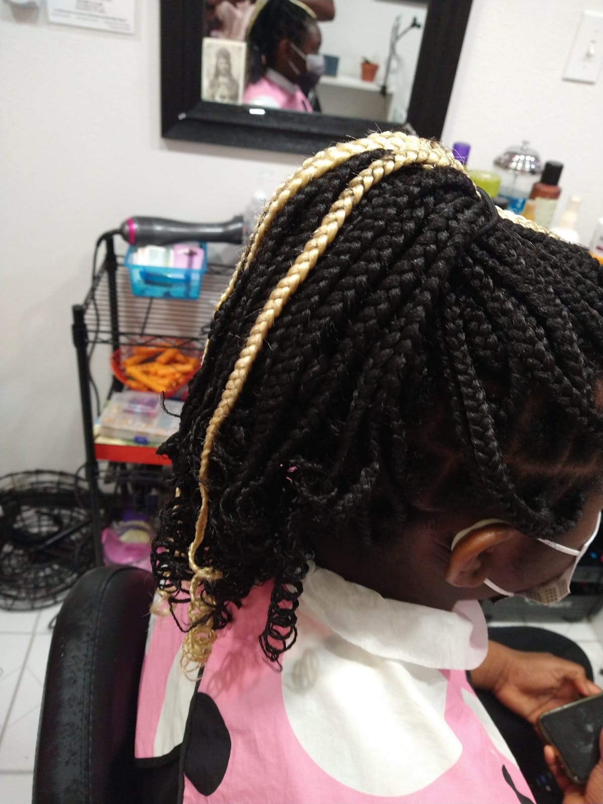 Side view image of previous black and white braids