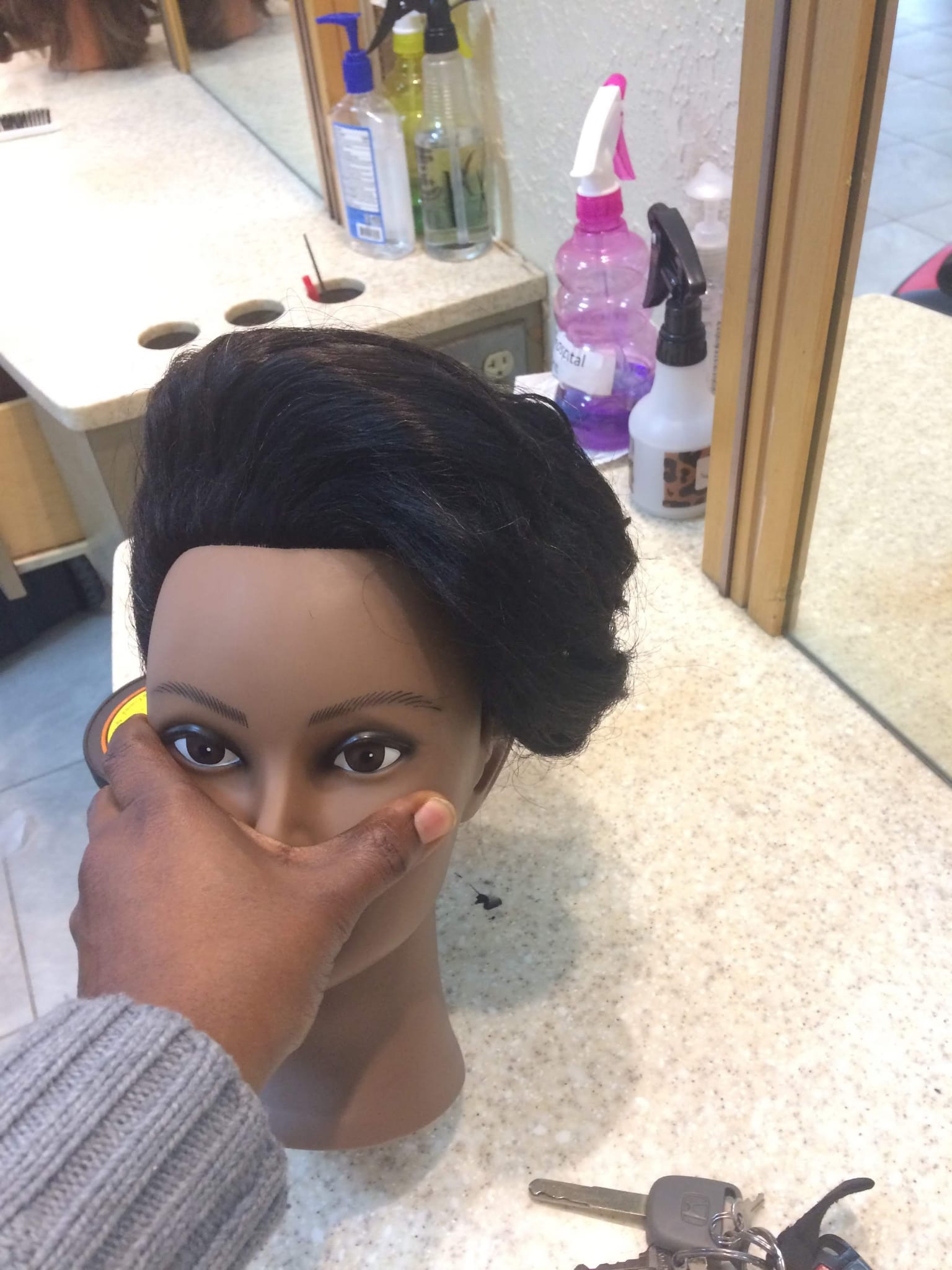 Previous mannequin with bridal updo hairstyle from the front