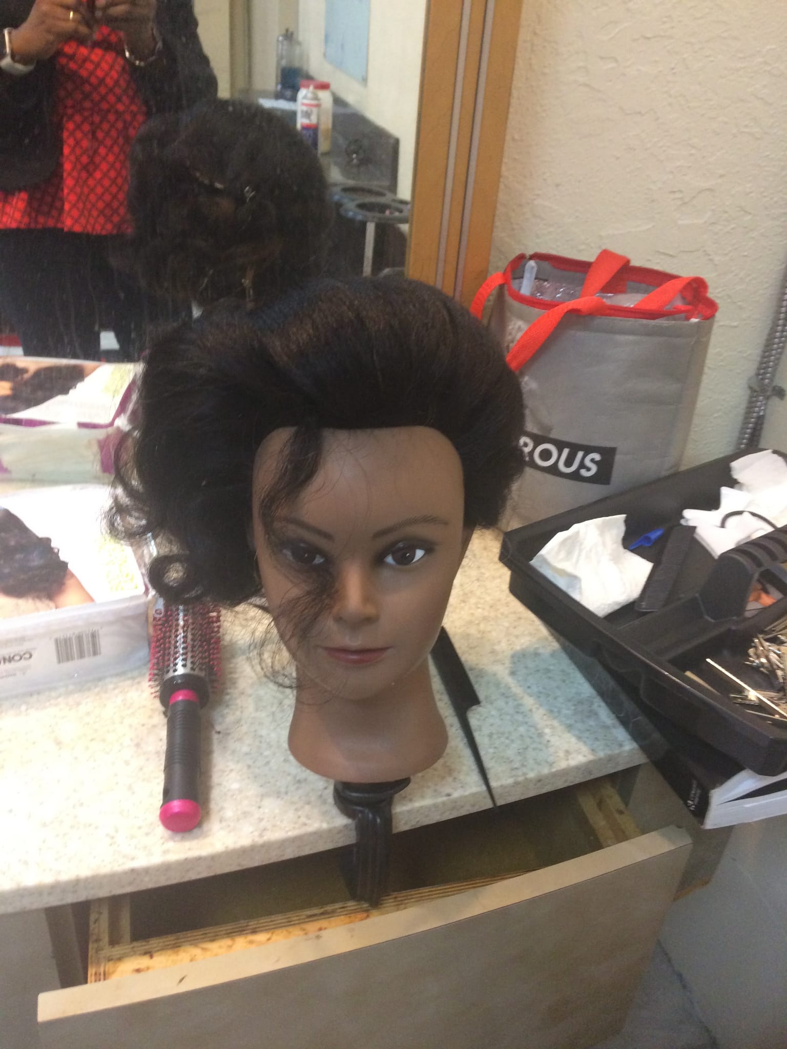 Mannequin with tall bridal updo hairstyle