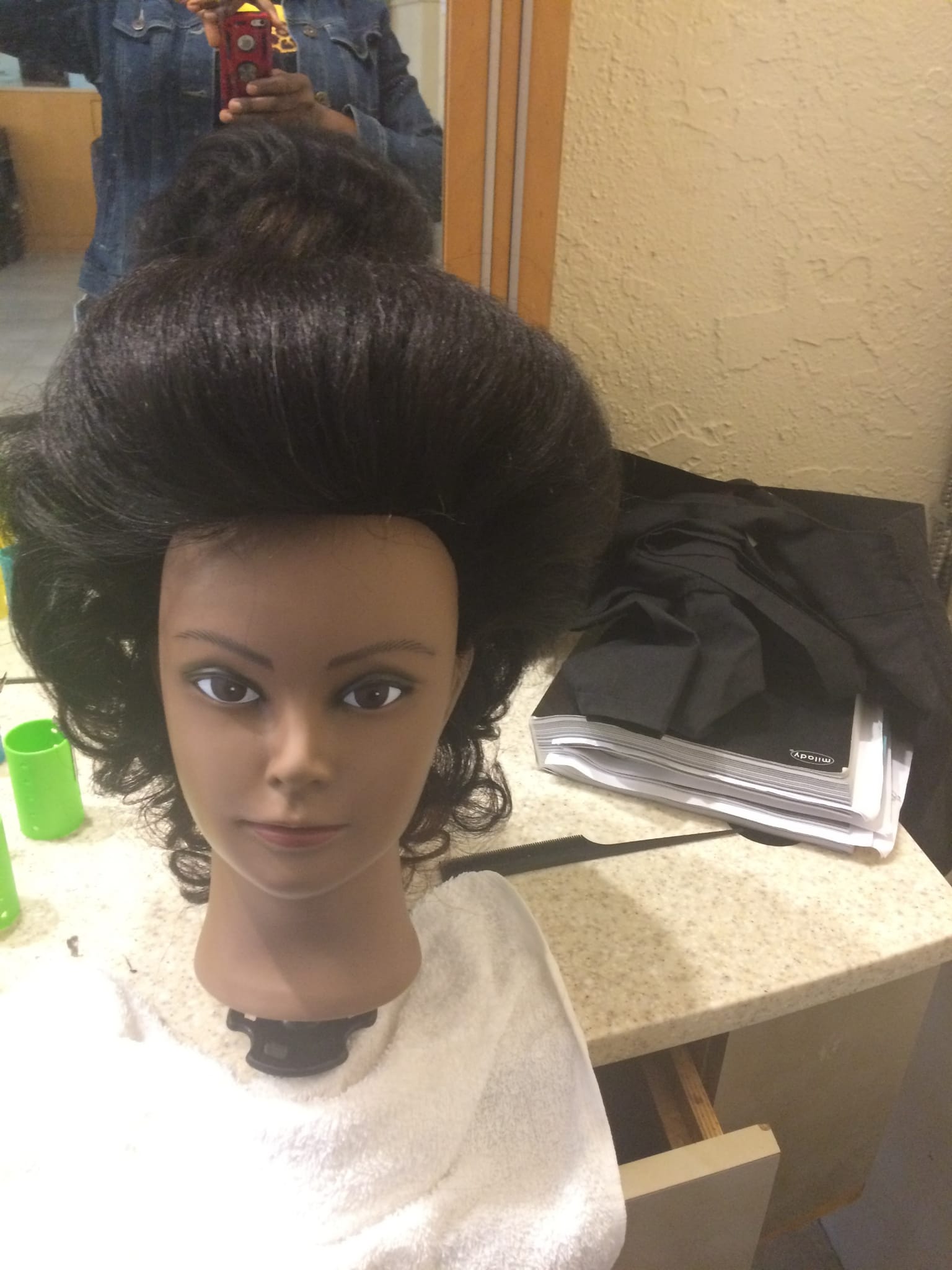 Mannequin with high bridal updo hairstyle